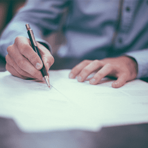 Image of a person writing a strategic plan